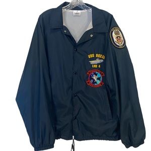 Windbreaker with patches. Size large.